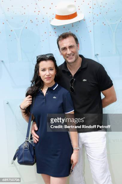 Actors of the Theater Play "Le Fusible", Gaelle Gauthier and Arnaud Gidoin, all dressed in Lacoste, attend the 2017 French Tennis Open - Day Two at...