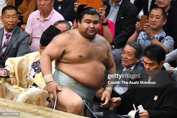 Sekiwake Takayasu reacts after his defeat by Shodai during day fourteen of the Grand Sumo Summer Tournament at Ryogoku Kokugikan on May 27, 2017 in...