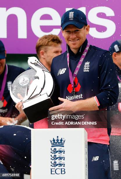 England's Eoin Morgan poses with the trophy after England won their One-Day International series, at the end of the third One-Day International...