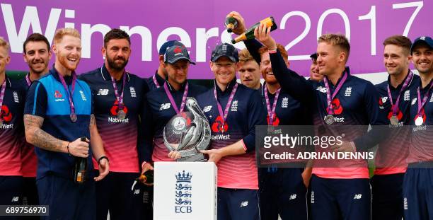 England's Eoin Morgan poses with the trophy after England won their One-Day International series, at the end of the third One-Day International...