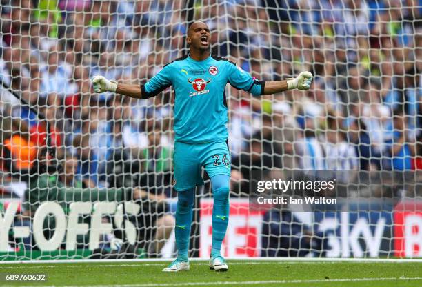 Ali Al-Habsi of Reading celebrates saving a penalty from Michael Hefele of Huddersfield Town during the penalty shoot out during the Sky Bet...