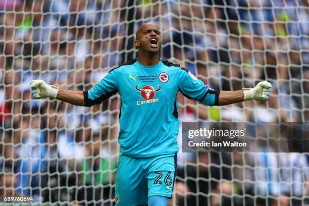 Ali Al-Habsi of Reading celebrates saving a penalty from Michael Hefele of Huddersfield Town during the penalty shoot out during the Sky Bet...