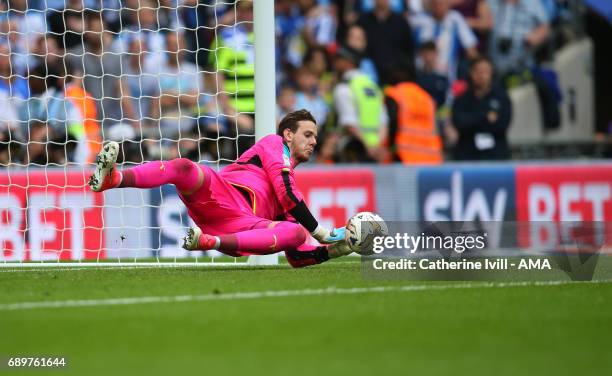 Goalkeeper Danny Ward of Huddersfield Town saves a penalty during the shootout during the Sky Bet Championship Play Off Final match between Reading...