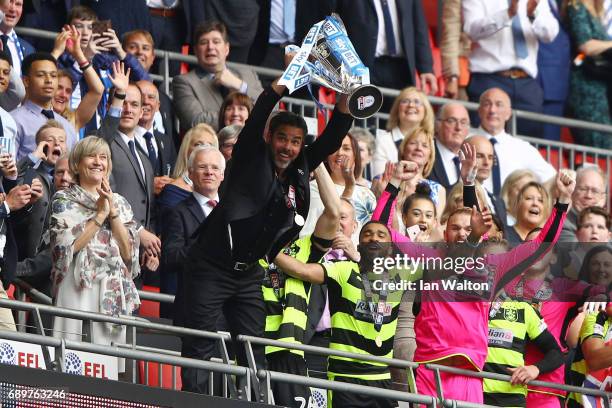 David Wagner, Manager of Huddersfield Town lifts The Championship play off trophy after gaining promotion to the Premier Leauge after the Sky Bet...