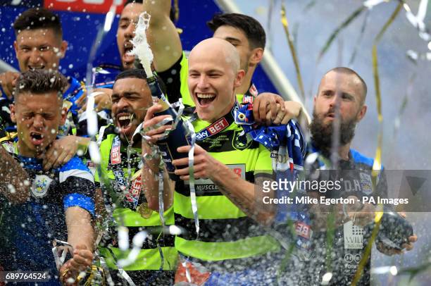 Huddersfield Town's Aaron Mooy celebrates winning the Sky Bet Championship play-off final at Wembley Stadium, London.