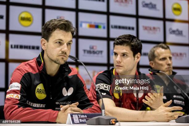 Timo Boll , Dimitrij Ovtcharov and men's National Coach Joerg Rosskopf of Germany attend a press conference of a German team at Table Tennis World...