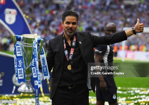 David Wagner, Manager of Huddersfield Town celebrates with The Championship play off trophy after the Sky Bet Championship play off final between...