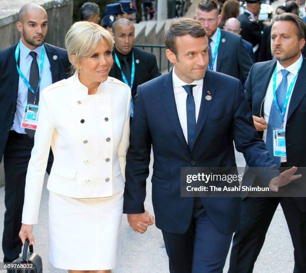 French President Emmanuel Macron and his wife Brigitte arrive at the Teatro Greco for a concert during the first day of the G7 Summit on May 26, 2017...