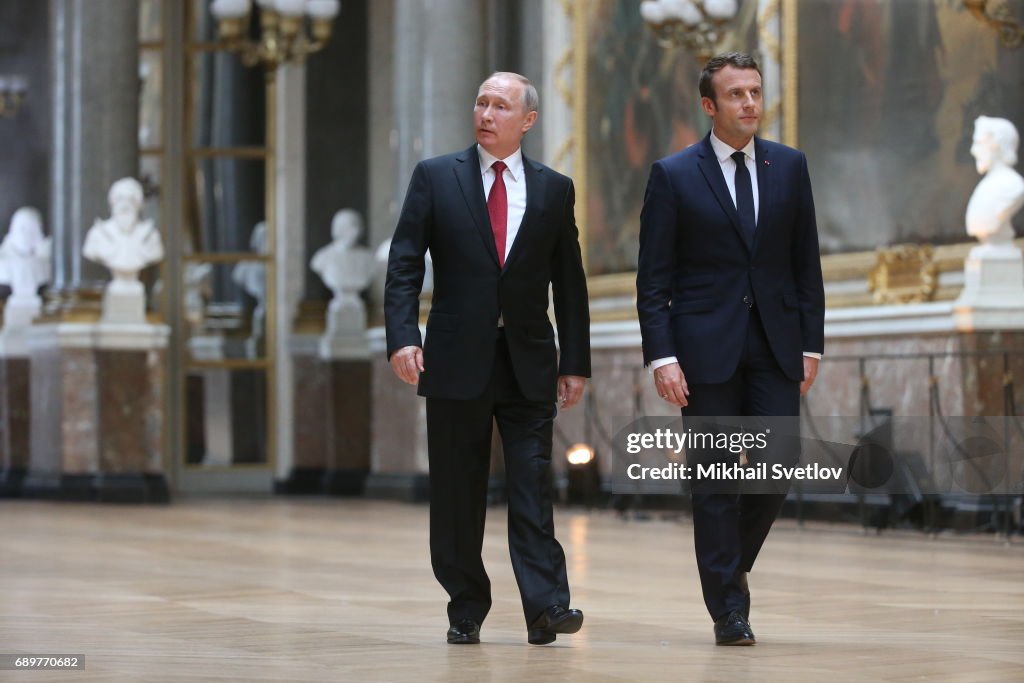 French President Emmanuel Macron receives Russian President Vladimir Putin in Versailles