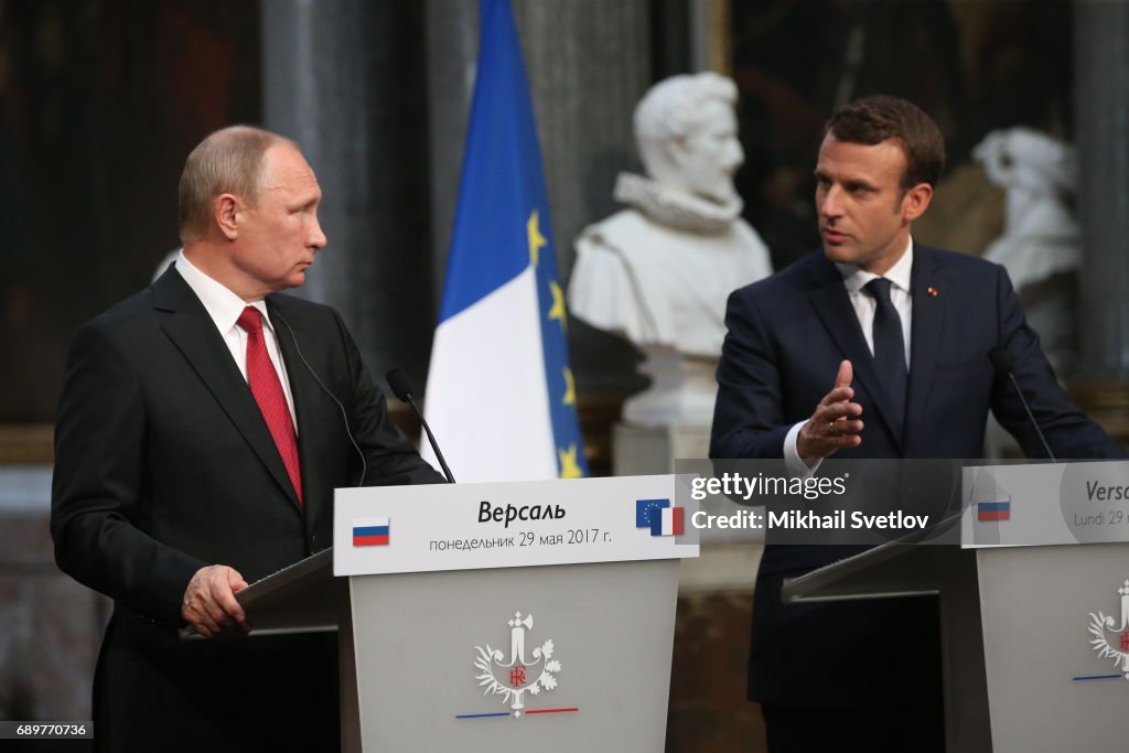 French President Emmanuel Macron receives Russian President Vladimir Putin in Versailles