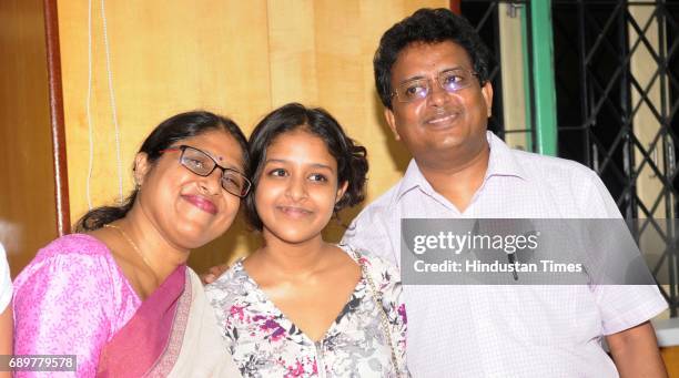 All India topper Ananya Maity of Heritage School with parents Shreyoshi and Dr. Chinmoy Maity scoring 99.5% during her interaction with media at...