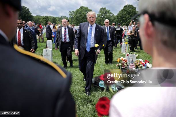 President Donald Trump greets families of the fallen in Section 60 at Arlington National Cemetery on Memorial Day May 29, 2017 in Arlington,...