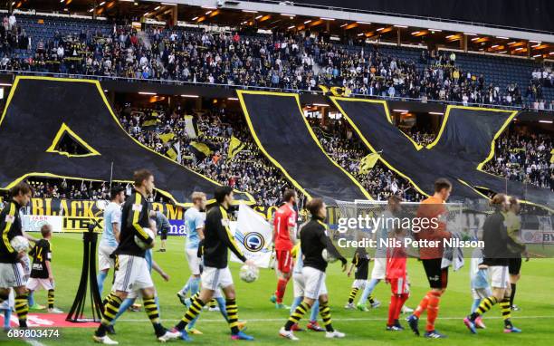 Players walk on the pitch ahead of the Allsvenskan match between AIK and Malmo FF at Friends arena on May 29, 2017 in Solna, Sweden.