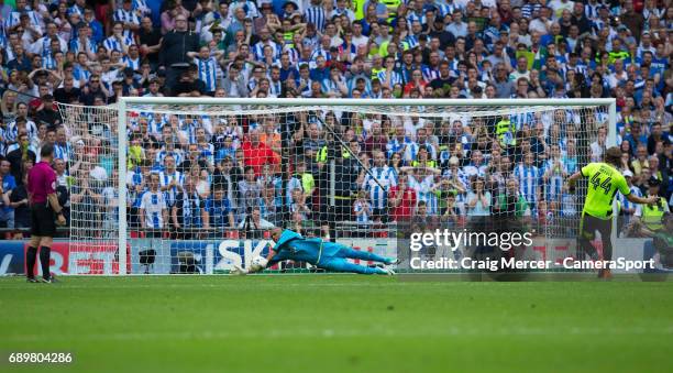 Reading's Ali Al-Habsi saves the penalty of Huddersfield Town's Michael Hefele during the EFL Sky Bet Championship Play-Off Final match between...