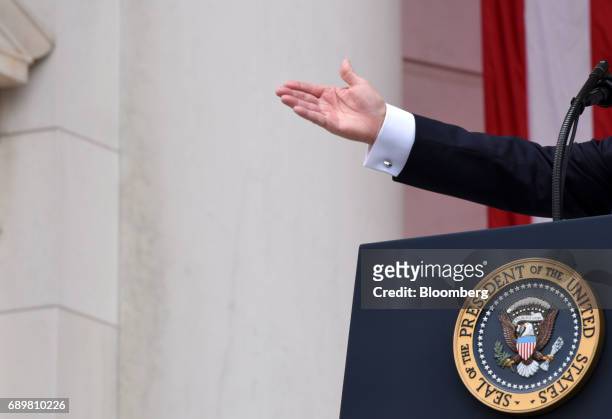 President Donald Trump gestures while speaking at a wreath laying ceremony at the Tomb of the Unknown Soldier at Arlington National Cemetery in...