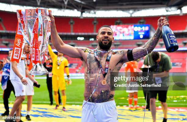 Kyle Vassell of Blackpool celebrates victory and promotion with the trophy after the Sky Bet League Two Playoff Final between Blackpool and Exeter...