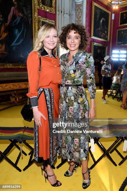 Kirsten Dunst and Valeria Golino attend the Gucci Cruise 2018 fashion show at Palazzo Pitti on May 29, 2017 in Florence, Italy.