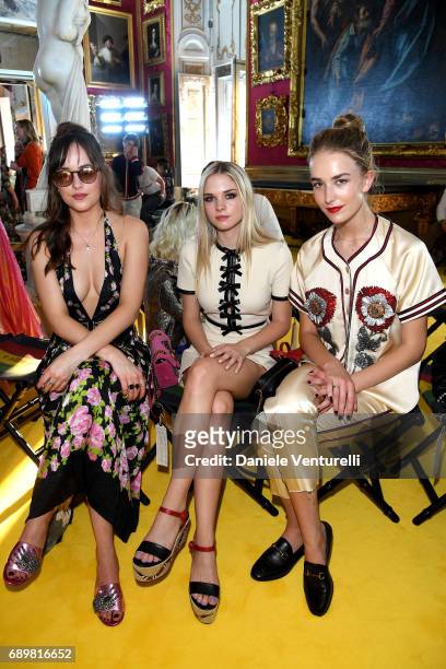 Dakota Johnson, Stella Banderas and Grace Johnson attend the Gucci Cruise 2018 fashion show at Palazzo Pitti on May 29, 2017 in Florence, Italy.