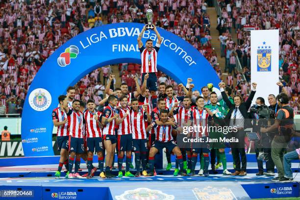 Carlos Salcido of Chivas lifts the champions trophy after winning the Final second leg match between Chivas and Tigres UANL as part of the Torneo...