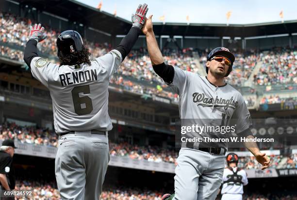 Ryan Zimmerman of the Washington Nationals is congratulated by Anthony Rendon after Zimmerman scored against the San Francisco Giants in the top of...