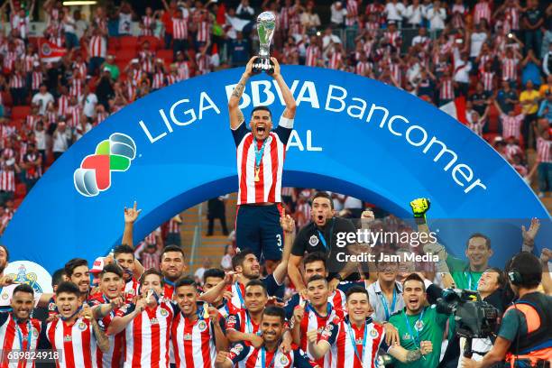 Carlos Salcido of Chivas lifts the champions trophy after winning the Final second leg match between Chivas and Tigres UANL as part of the Torneo...