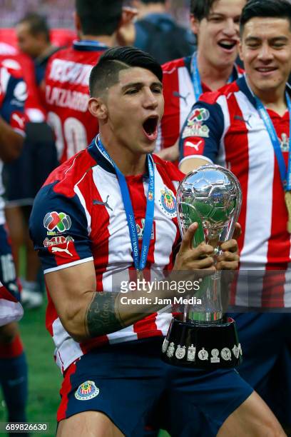 Alan Pulido of Chivas celebrates with the champions trophy after winning the Final second leg match between Chivas and Tigres UANL as part of the...