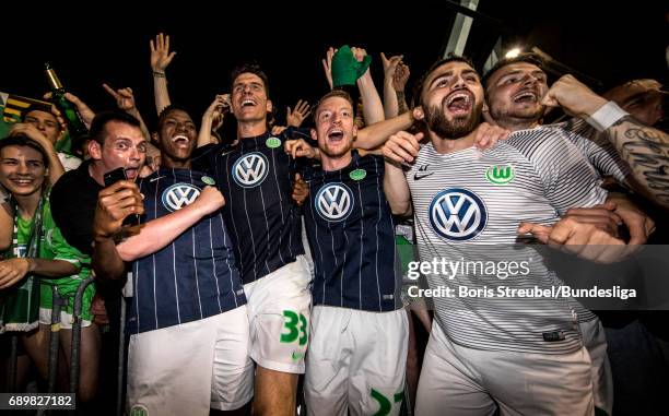 Players of VfL Wolfsburg celebrate the continuance in the first Bundesliga after winning the Bundesliga Playoff Leg 2 match between Eintracht...
