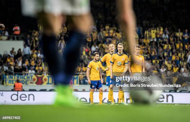 Players of Eintracht Braunschweig wait for a free-kick during the Bundesliga Playoff Leg 2 match between Eintracht Braunschweig and VfL Wolfsburg at...