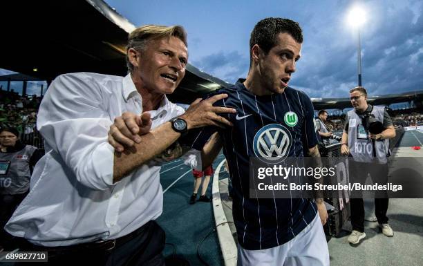 Vieirinha of VfL Wolfsburg celebrates with head coach Andries Jonker of VfL Wolfsburg after scoring his team's first goal during the Bundesliga...