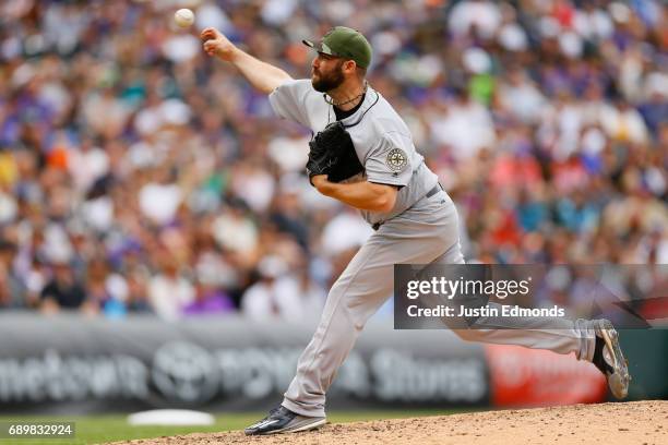 Relief pitcher Tony Zych of the Seattle Mariners delivers to home plate during the seventh inning against the Colorado Rockies during interleague...