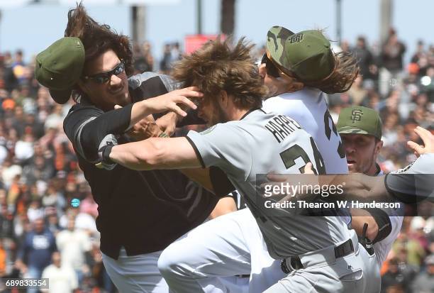 Jeff Samardzija of the San Francisco Giants goes after Bryce Harper of the Washington Nationals after Harper charged the mound from being hit by a...