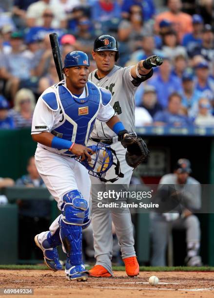 Miguel Cabrera of the Detroit Tigers appeals to the first base umpire for a call as catcher Salvador Perez of the Kansas City Royals looks on during...