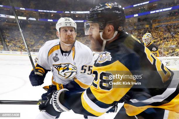 Cody McLeod of the Nashville Predators body checks Ian Cole of the Pittsburgh Penguins during the first period in Game One of the 2017 NHL Stanley...