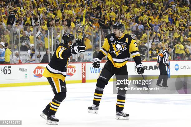 Evgeni Malkin of the Pittsburgh Penguins celebrates with Trevor Daley after scoring a goal during the first period in Game One of the 2017 NHL...