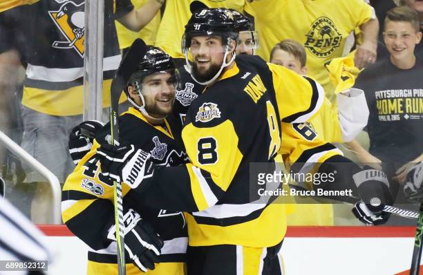Conor Sheary of the Pittsburgh Penguins celebrates with Brian Dumoulin of the Pittsburgh Penguins after scoring a goal during the first period in...