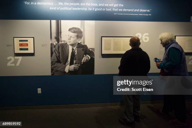 Guests check out various items from President John F. Kennedy's on display at the JFK 100: Milestones & Mementos Exhibit at the John F. Kennedy...