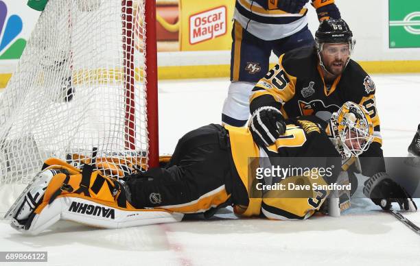 Goaltender Matt Murray of the Pittsburgh Penguins reacts after making a save with teammate Ron Hainsey during the first period of Game One of the...