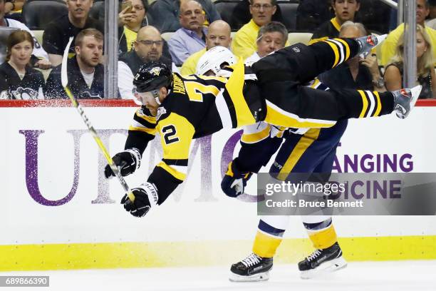 Patric Hornqvist of the Pittsburgh Penguins goes airborne after a check by James Neal of the Nashville Predators during the third period in Game One...