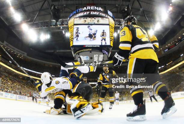 Nashville Predators center Filip Forsberg trips over Pittsburgh Penguins goalie Matt Murray during the third period in Game One of the 2017 NHL...