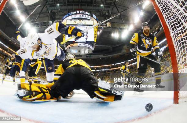 Nashville Predators left wing James Neal collides with Pittsburgh Penguins goalie Matt Murray as center Colton Sissons scores at 10:13 of the third...