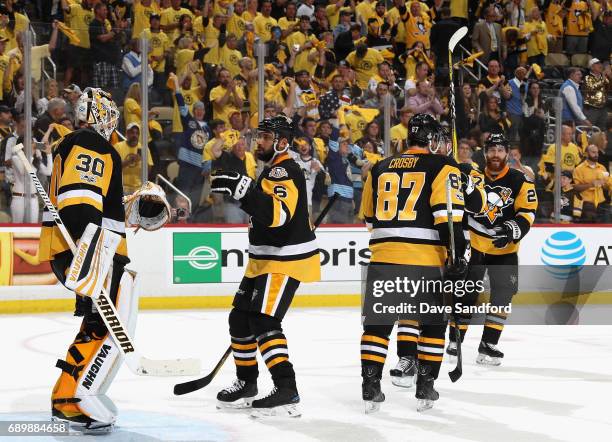 Trevor Daley of the Pittsburgh Penguins congratulates goaltender Matt Murray after their 5-3 win over the Nashville Predators in Game One of the 2017...