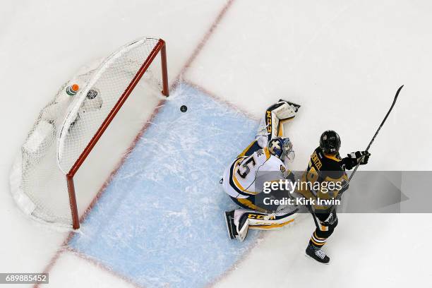 Jake Guentzel of the Pittsburgh Penguins scores a goal past Pekka Rinne of the Nashville Predators in Game One of the 2017 NHL Stanley Cup Final at...