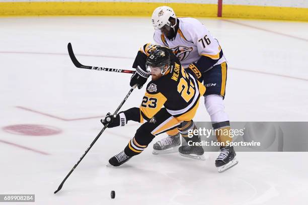 Pittsburgh Penguins center Scott Wilson and Nashville Predators defenseman P.K. Subban battle for the puck during the first period. The Pittsburgh...