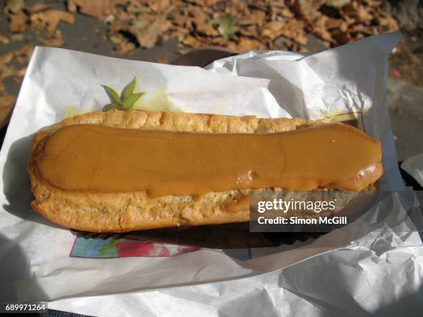 coffee flavoured eclair - eclair stock pictures, royalty-free photos & images