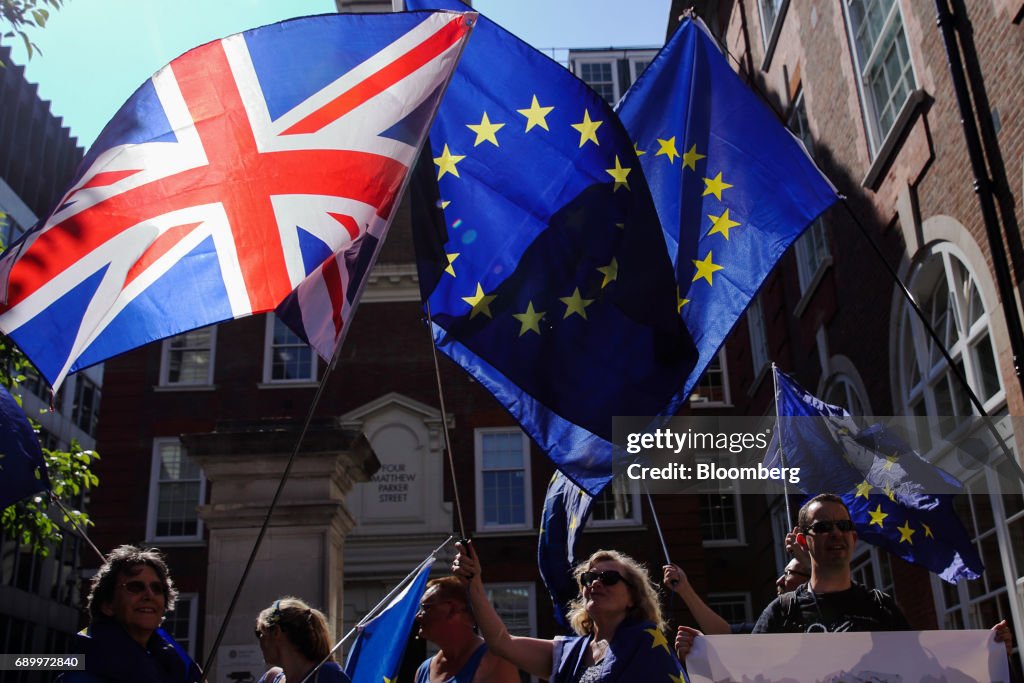 Pro-Europe and anti-Brexit campaigners demonstrate outside the offices of Prime Minister Theresa May's governing party the Conservative Campaign Headquarters  in London