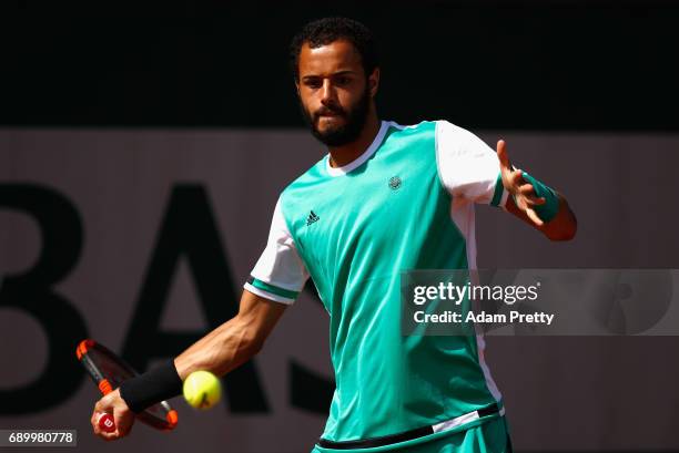 Laurent Lokoli of France plays a forehand during the mens singles first round match against Martin Klizan of Slovakia on day three of the 2017 French...