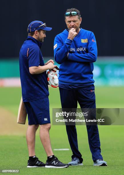 Mike Hesson, Coach of New Zealand talks to Graham Ford, Coach of Sri Lanka during the ICC Champions Trophy Warm-up match between New Zealand and Sri...