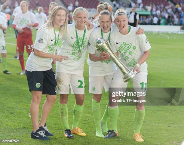 Pernille Harder of Wolfsburg and Caroline Graham Hasen of Wolfsburg and Alexandera Popp of Wolfsburg celebrates the winning of the trophy with...