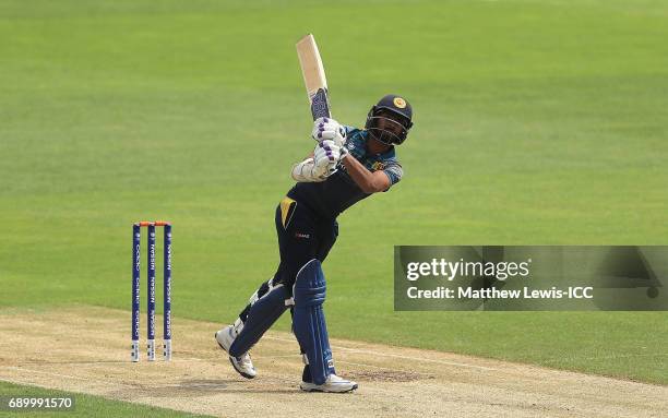 Niroshan Dickwella of Sri Lanka hits a six during the ICC Champions Trophy Warm-up match between New Zealand and Sri Lanka at Edgbaston on May 30,...