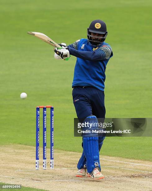 Upul Tharanga of Sri Lanka pulls the ball towards the boundary during the ICC Champions Trophy Warm-up match between New Zealand and Sri Lanka at...